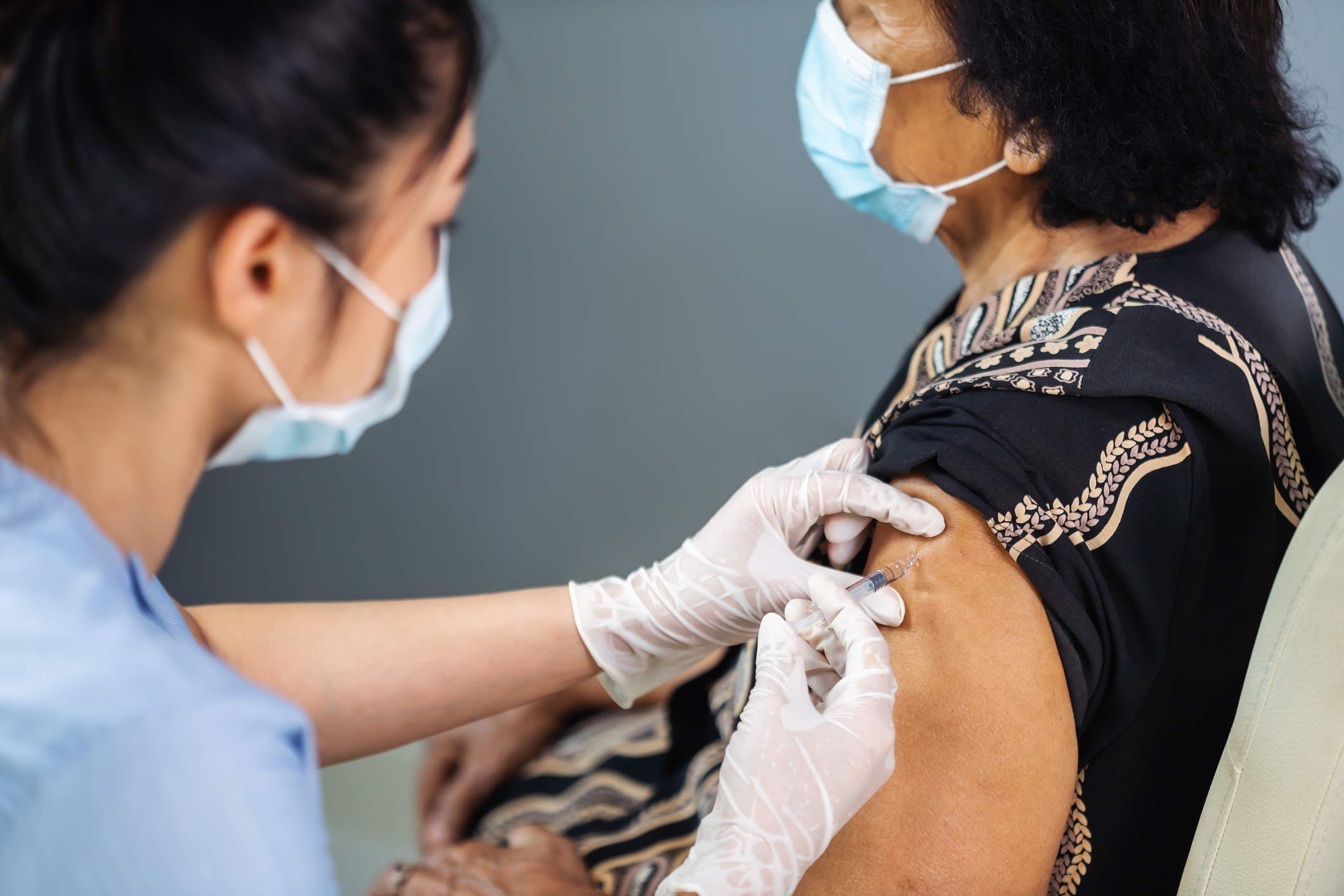 Woman receiving vaccine